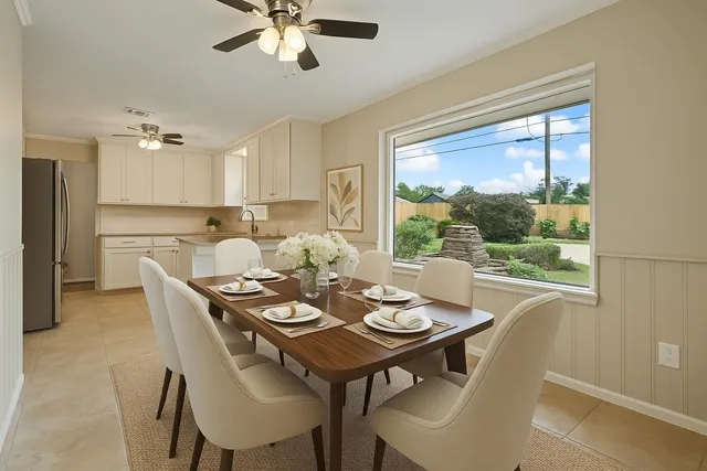 a view of a dining room with furniture window and outside view