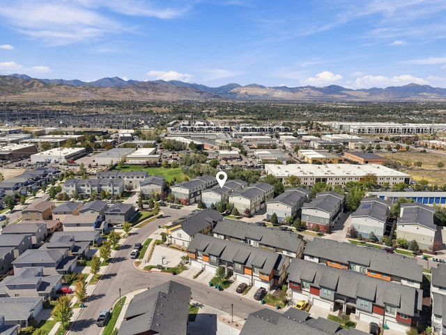 14764 Rising Star Way Riverton, UT 84065 - Photo 40 of 42 Townhome community with varied exterior finishes, established street trees, and mountain backdrop