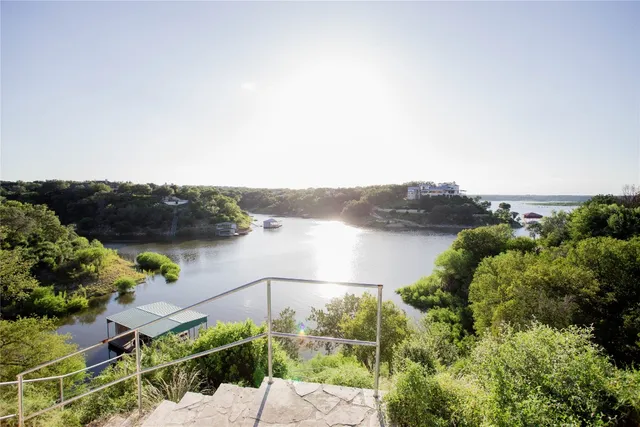 an aerial view of a house with a lake view