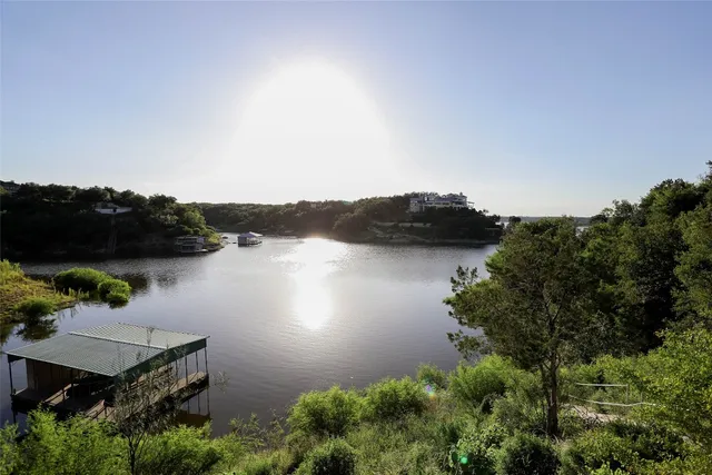 an aerial view of house with ocean view