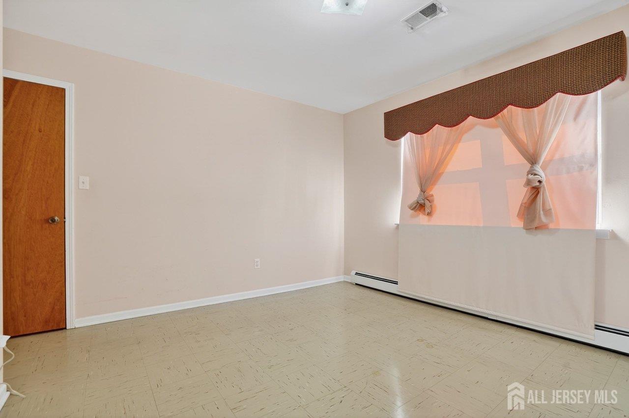 1 Wakefield Drive Edison, NJ 08820 - Photo 21 of 29 an empty room with a window