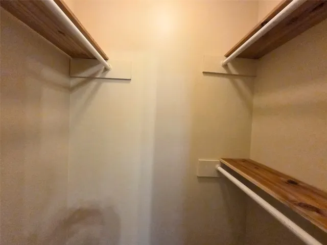 a view of a room with racks on the wall