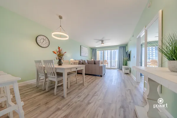 a view of a dining room with furniture window and wooden floor