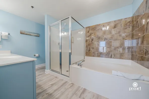a bathroom with a bathtub and a shower