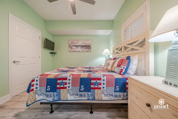 a bed room with a bed and a lamp