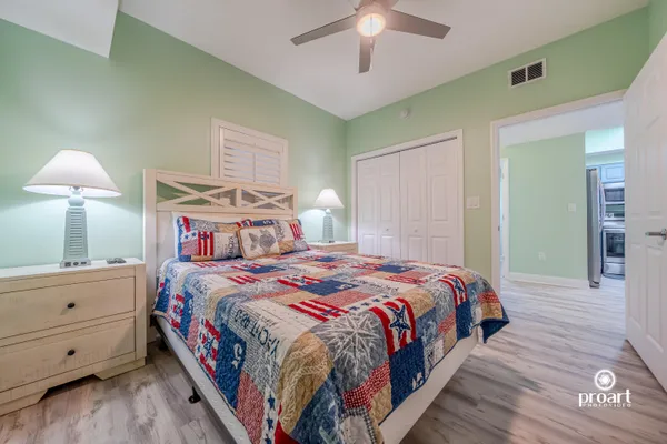 a bedroom with a bed and a table