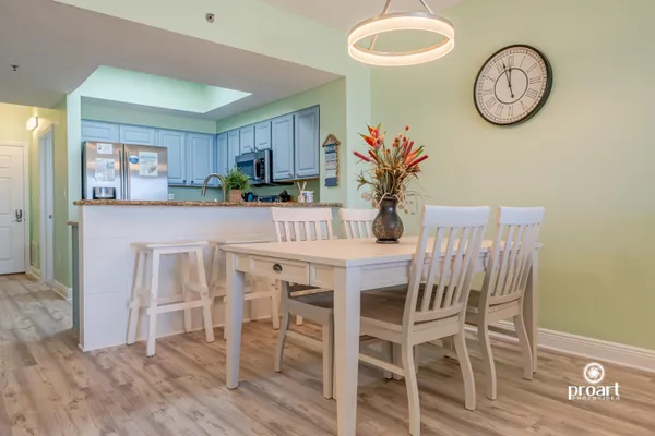 a dining room with furniture and a clock
