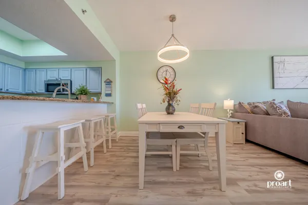 a view of a dining room with furniture and wooden floor