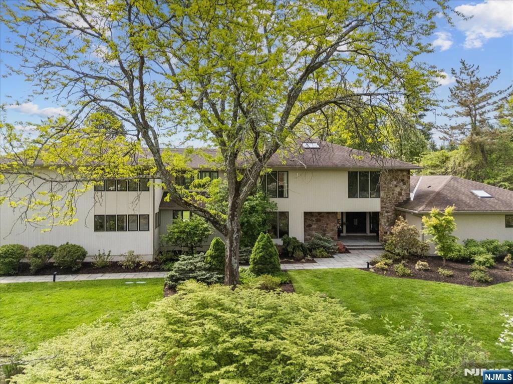 39 Eagle Nest Road Morris Township, NJ 07960 - Photo 4 of 43 a front view of house with yard and trees