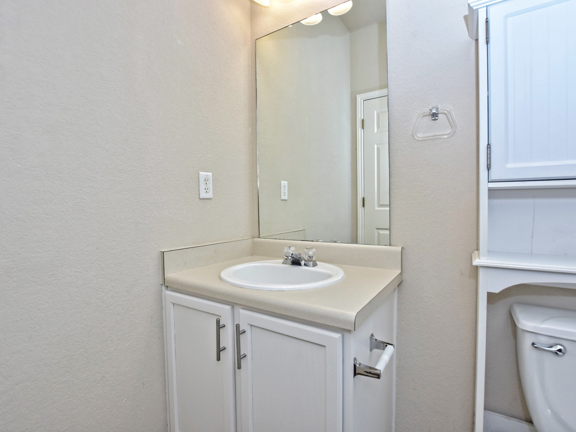917 East 3rd Street Georgetown, TX 78626 - Photo 7 of 23 Functional vanity with ample counter space and convenient under-sink storage.