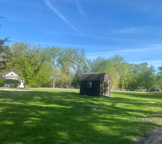 a view of a golf course with a big yard