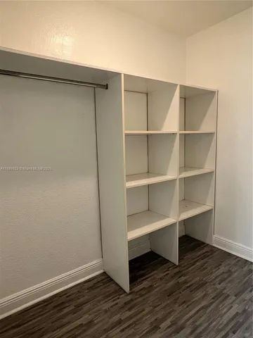 a view of an empty walk in closet