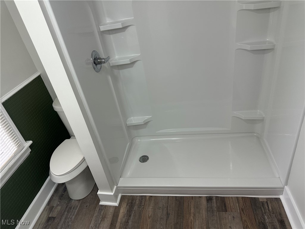 835 Inman Street Akron, OH 44306 - Photo 17 of 25 Full bath featuring a stall shower and dark wood-style flooring