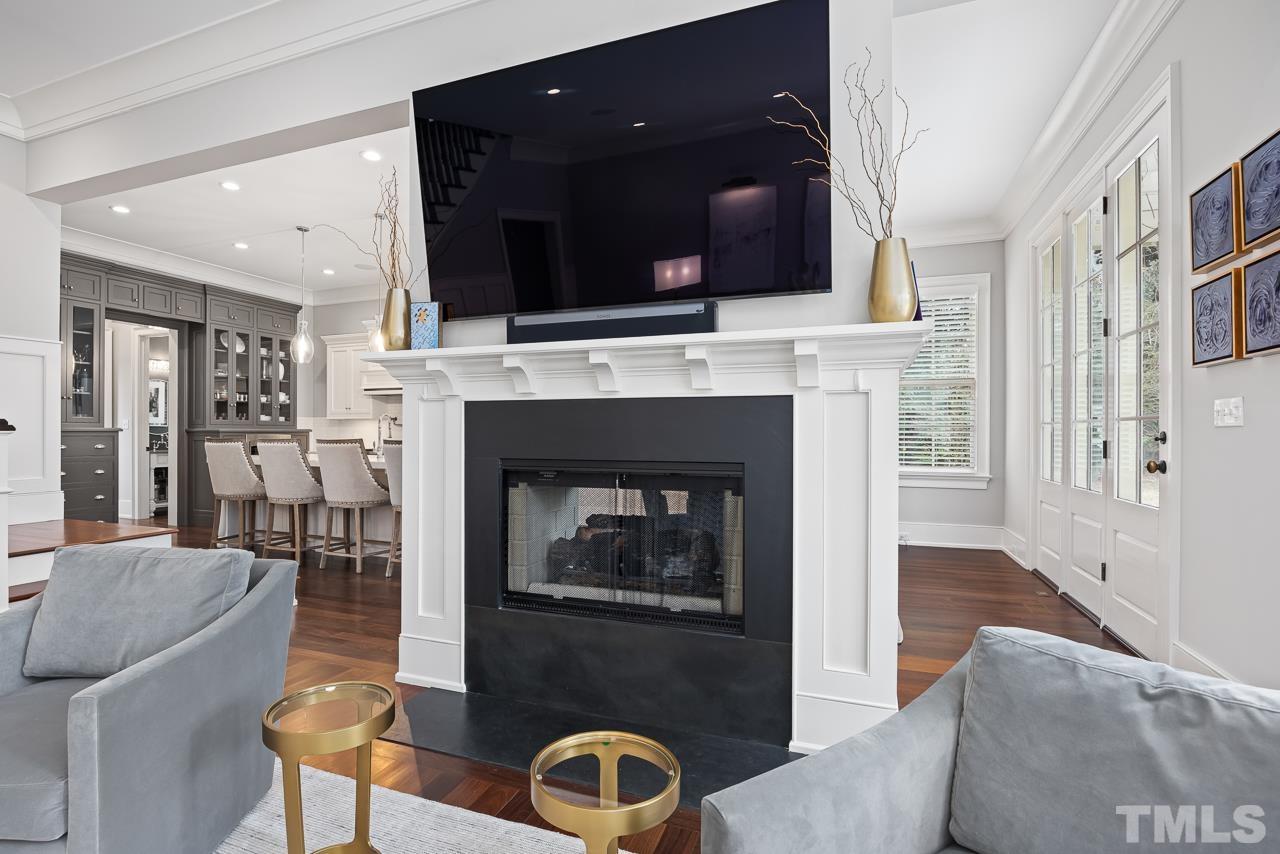 2908 Allansford Lane Raleigh, NC 27613 - Photo 14 of 64 a living room with furniture and a fireplace