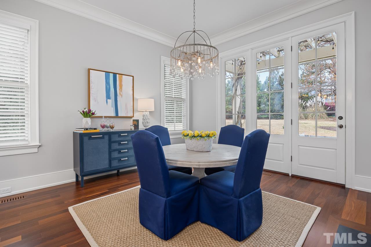 2908 Allansford Lane Raleigh, NC 27613 - Photo 18 of 64 a view of a dining room with furniture window and wooden floor