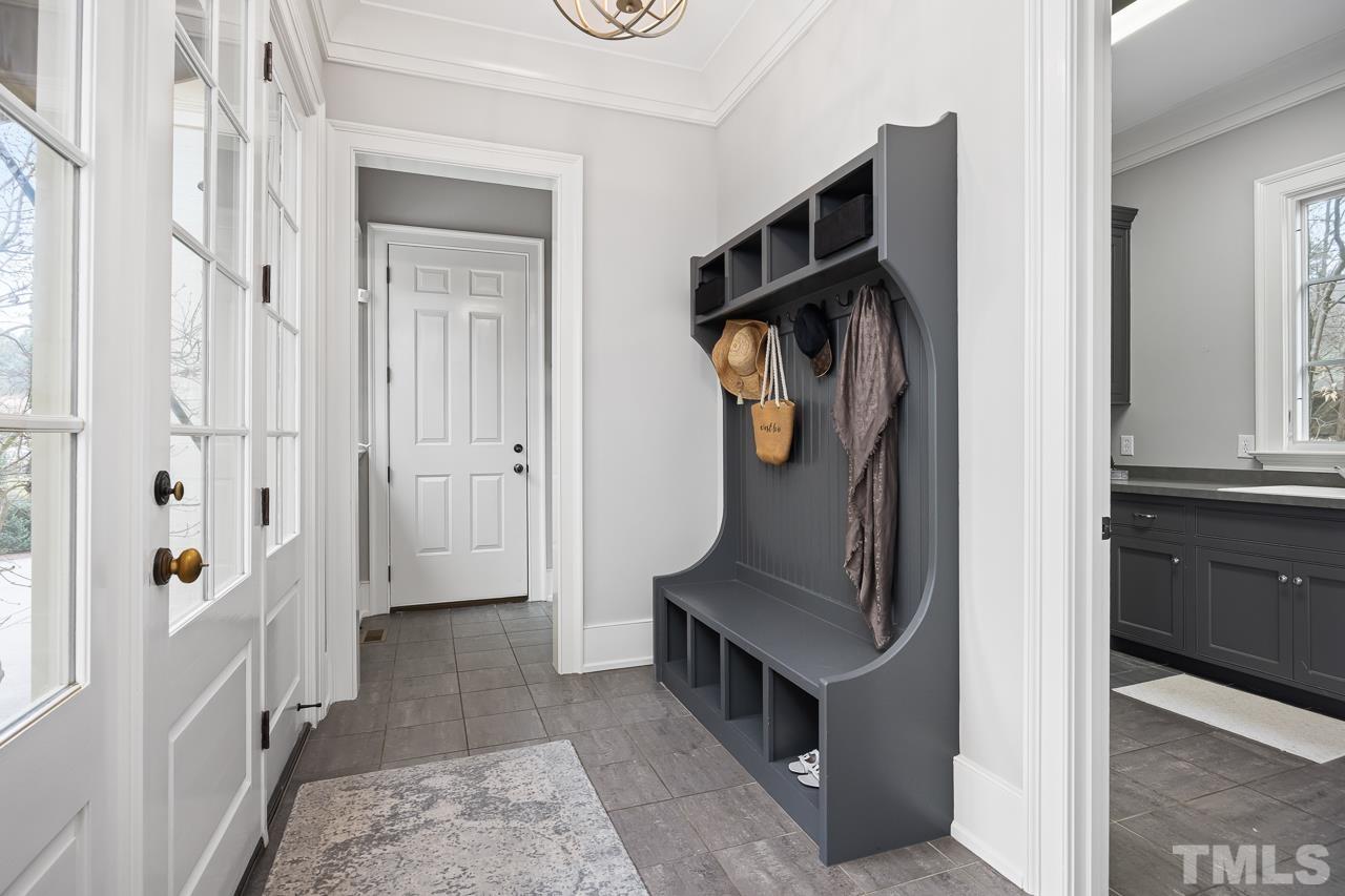 2908 Allansford Lane Raleigh, NC 27613 - Photo 22 of 64 a view of hallway with stairs and furniture