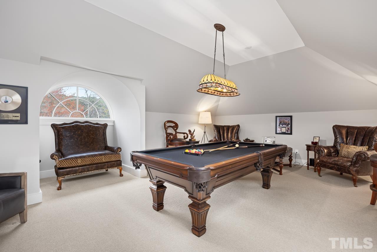 2908 Allansford Lane Raleigh, NC 27613 - Photo 24 of 64 a room with furniture and a chandelier