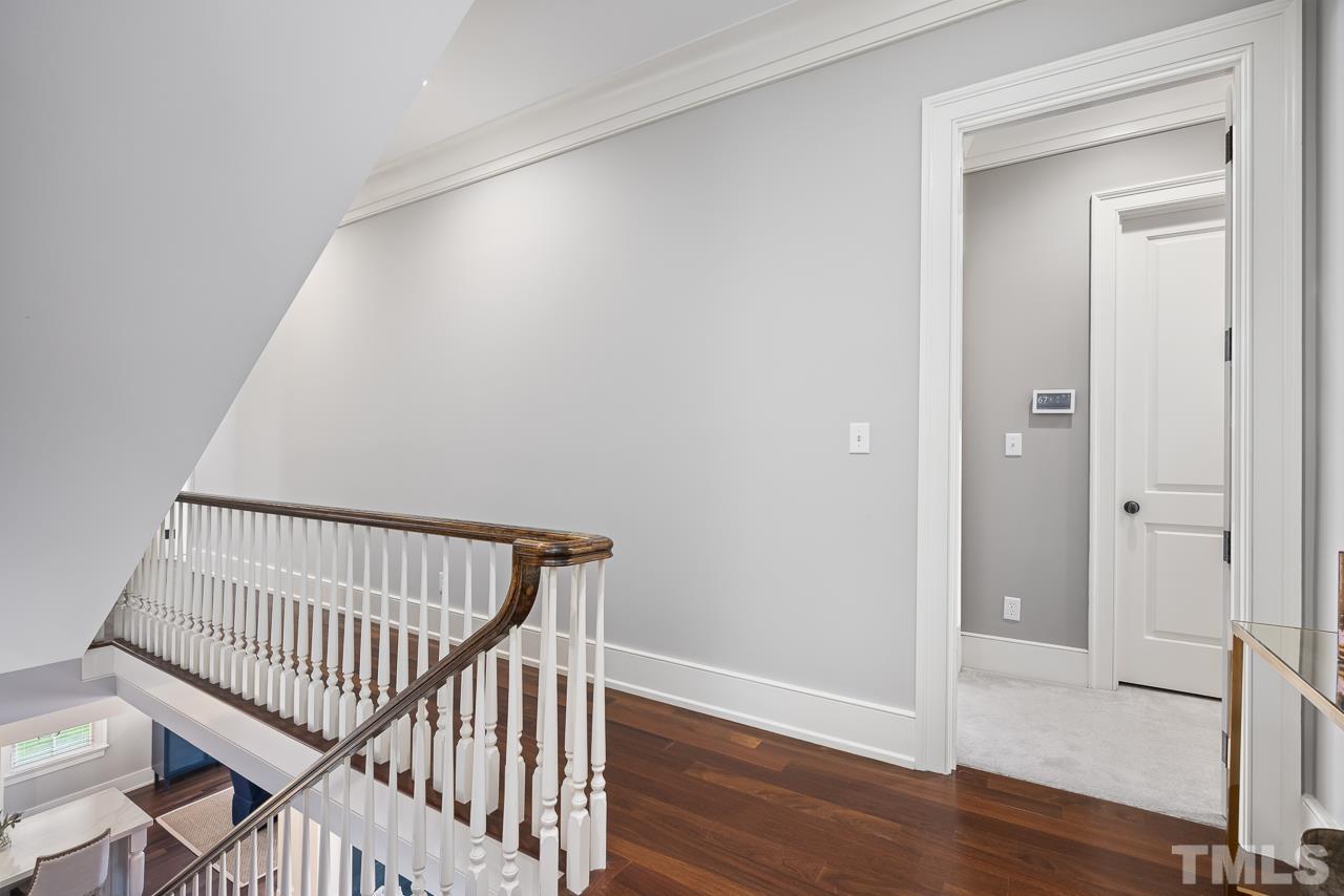 2908 Allansford Lane Raleigh, NC 27613 - Photo 28 of 64 a view of hallway with bedroom and wooden floor