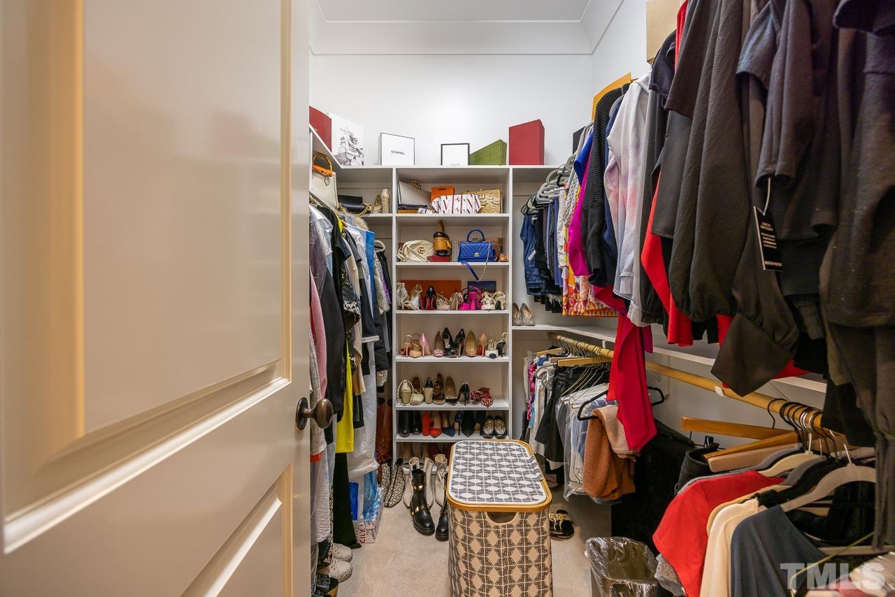 2908 Allansford Lane Raleigh, NC 27613 - Photo 35 of 64 a view of walk in closet with clothes and shoes