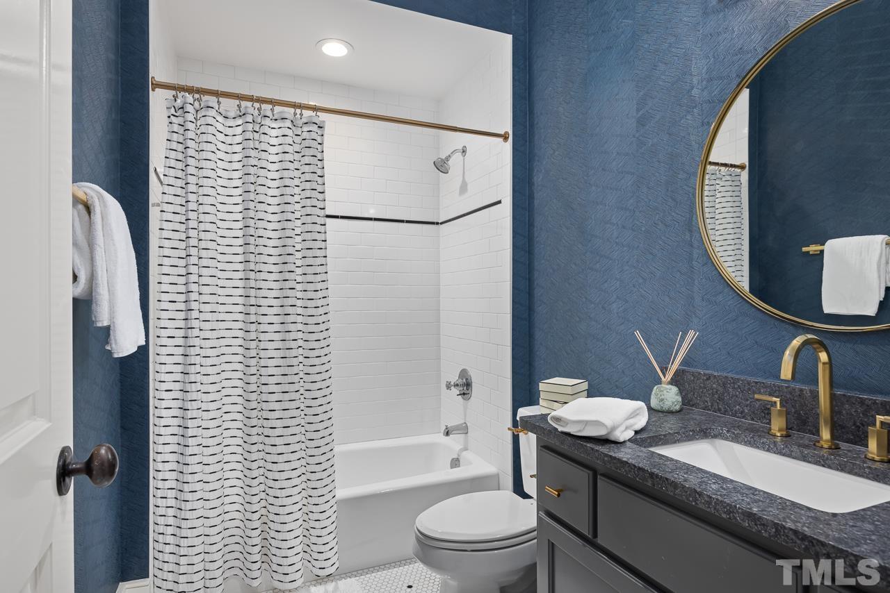 2908 Allansford Lane Raleigh, NC 27613 - Photo 43 of 64 a bathroom with a granite countertop sink toilet and shower
