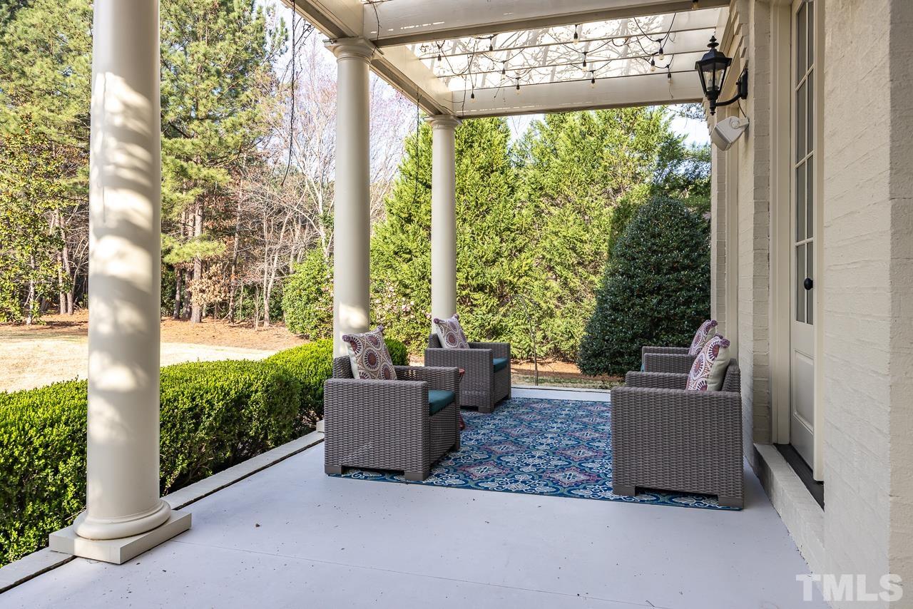 2908 Allansford Lane Raleigh, NC 27613 - Photo 48 of 64 a living room with couches and a potted plant