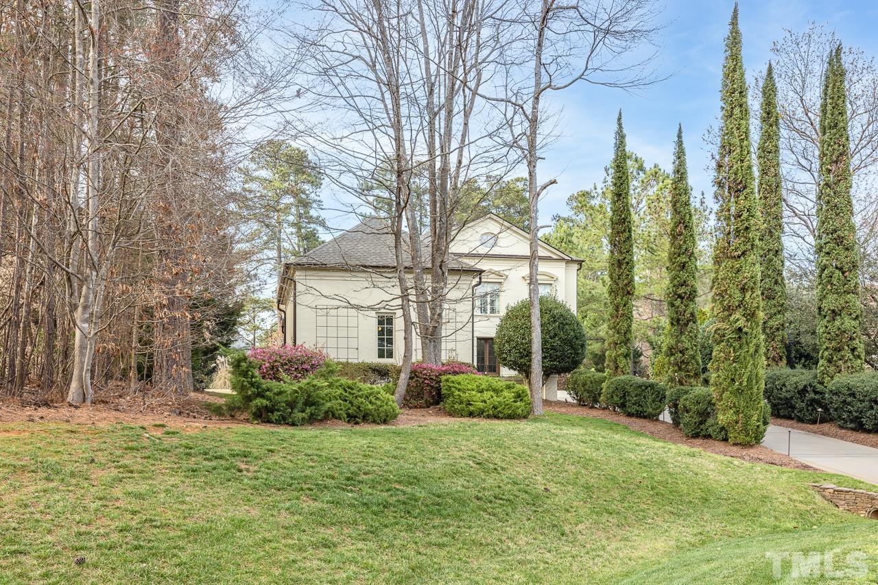 2908 Allansford Lane Raleigh, NC 27613 - Photo 56 of 64 a front view of a house with garden