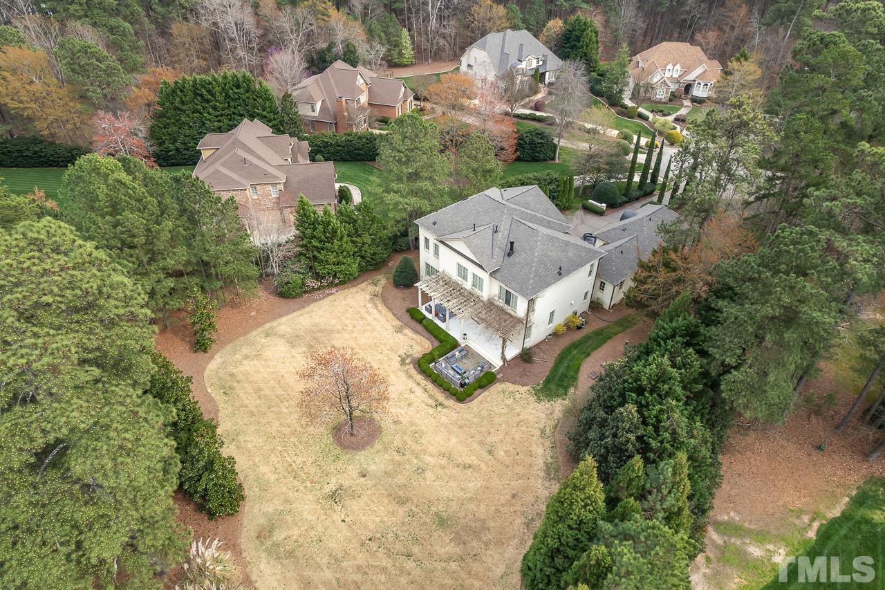 2908 Allansford Lane Raleigh, NC 27613 - Photo 62 of 64 an aerial view of a house with yard and garage