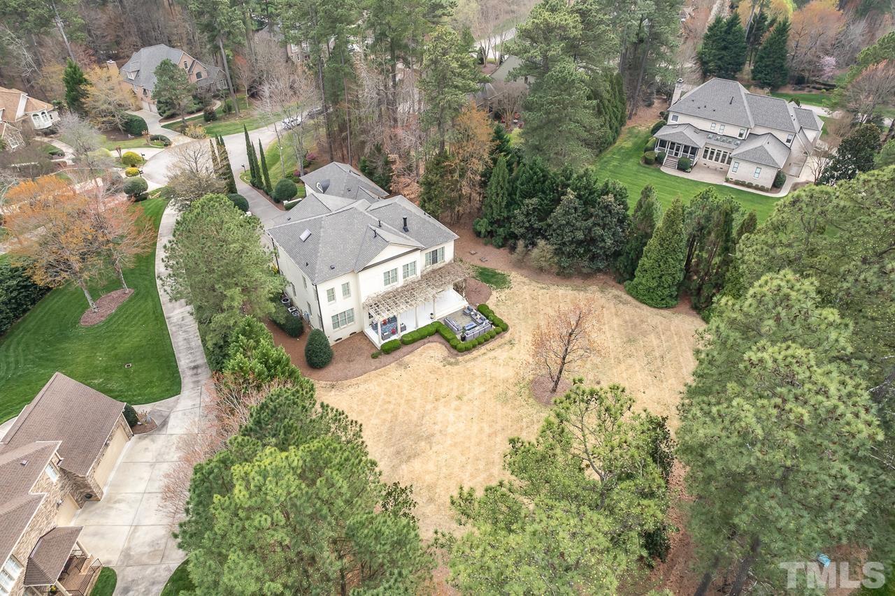 2908 Allansford Lane Raleigh, NC 27613 - Photo 63 of 64 an aerial view of a house with a yard and lake view