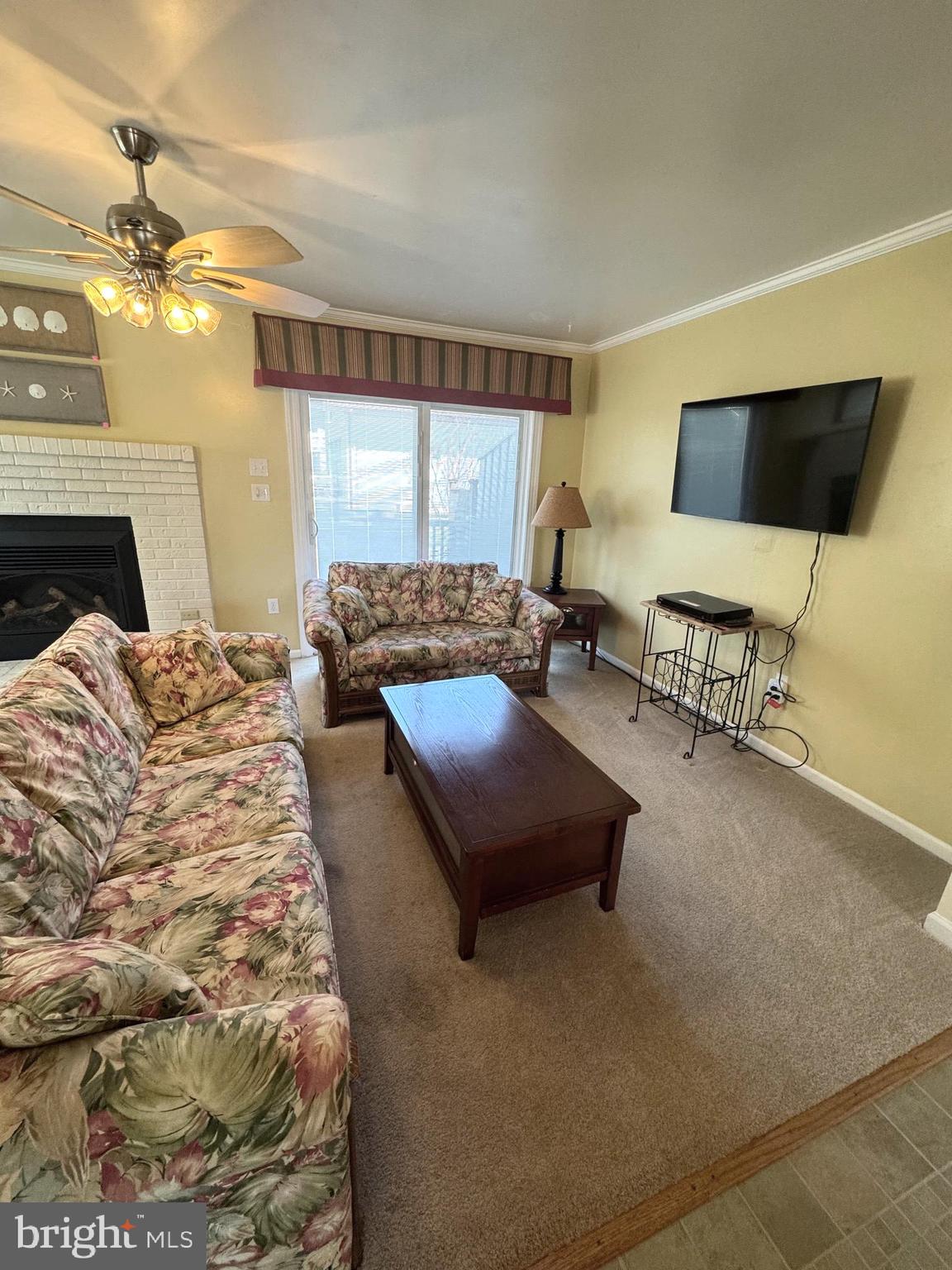 a bedroom with a bed a couch and dresser