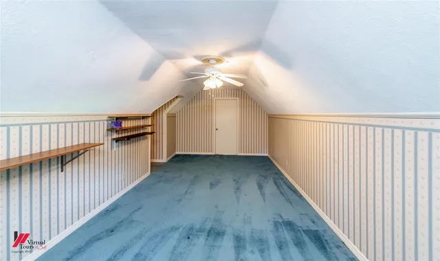a view of a hallway with stairs