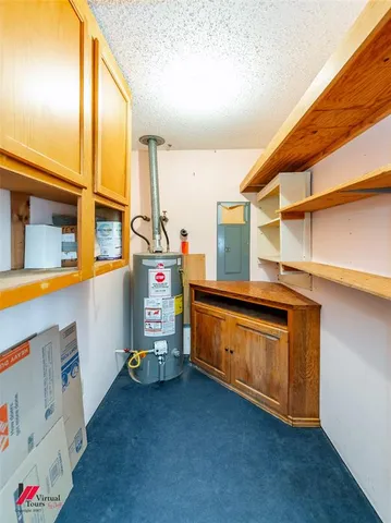 a utility room with closet dryer and washer