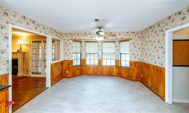 a view of an empty room and window