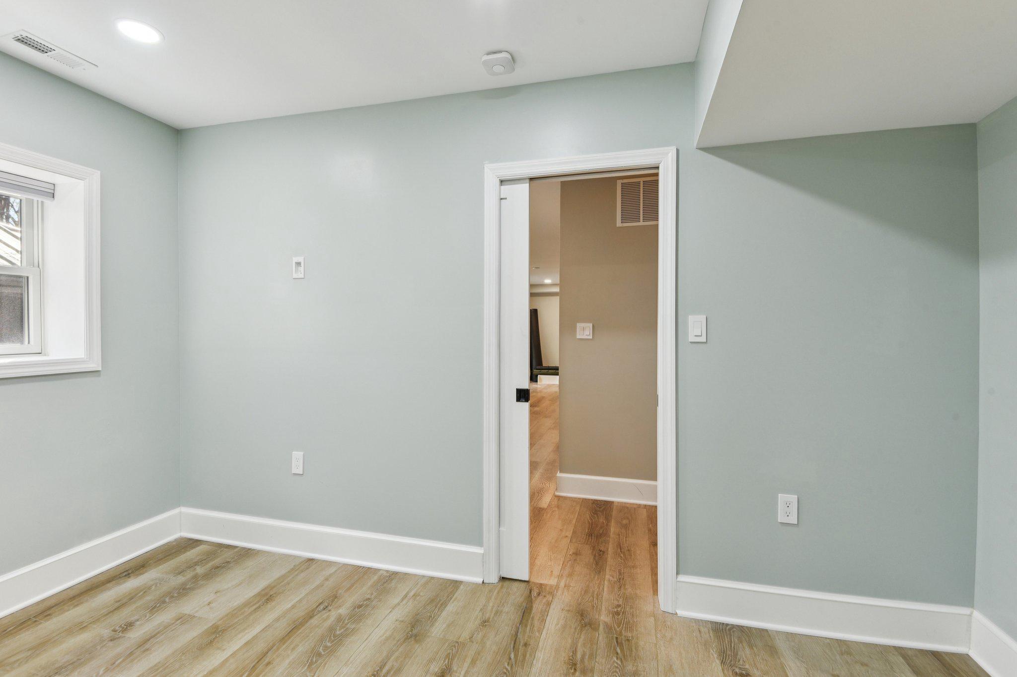 2576 Hidden Cove Road, Unit 154 Annapolis, MD 21401 - Photo 33 of 51 Pocket Doors entering lower level bedroom 5