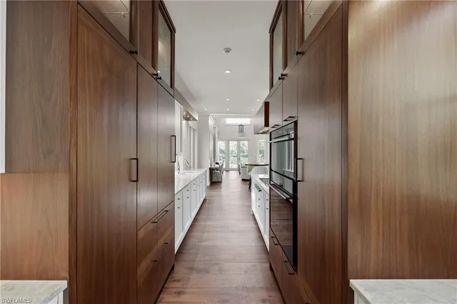 a view of hallway with wooden floor