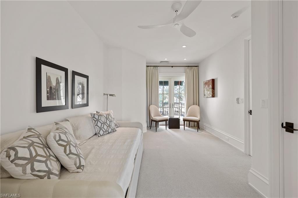 8057 Via Vecchia Naples, FL 34108 - Photo 30 of 42 a living room with furniture and a large window