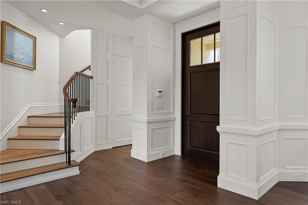 8057 Via Vecchia Naples, FL 34108 - Photo 4 of 42 an empty room with wooden floor and windows