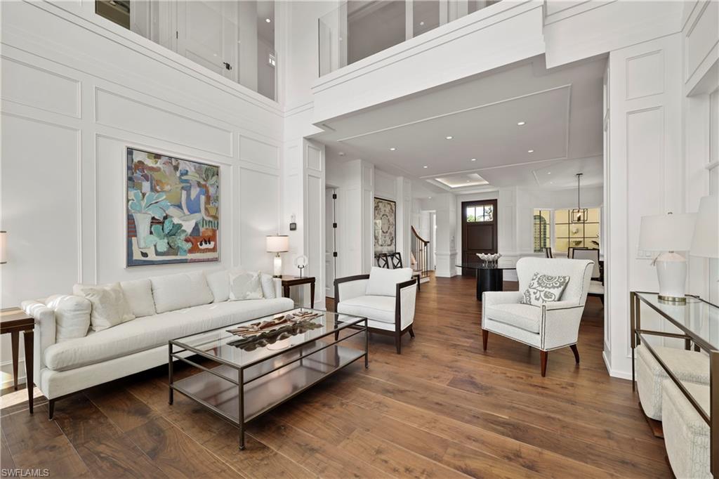 8057 Via Vecchia Naples, FL 34108 - Photo 7 of 42 a living room with furniture and a wooden floor