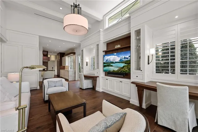 a large kitchen with a table and chairs