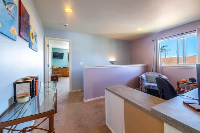 a view of workspace with furniture and window