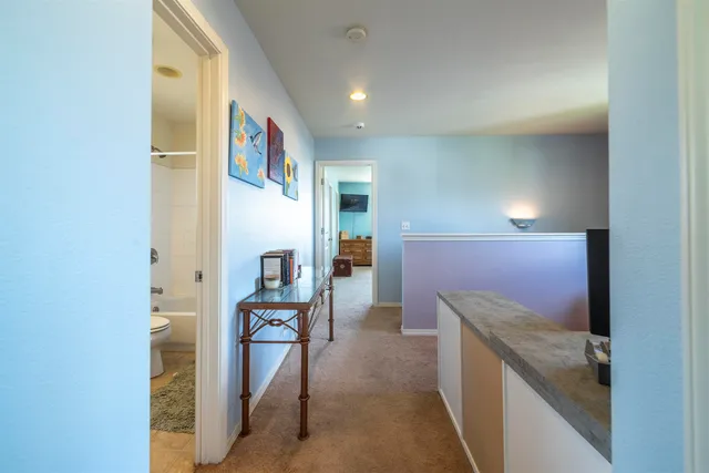 a hallway with cabinets