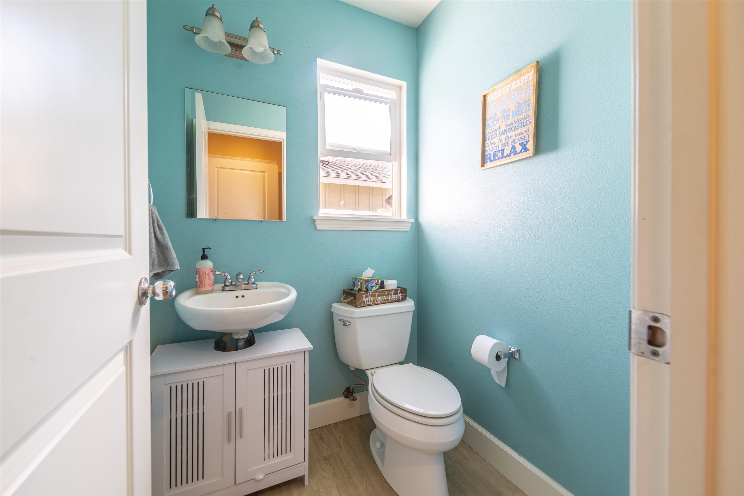 159 Iniiniki Street Wailuku, HI 96793 - Photo 15 of 33 a bathroom with a toilet sink and mirror