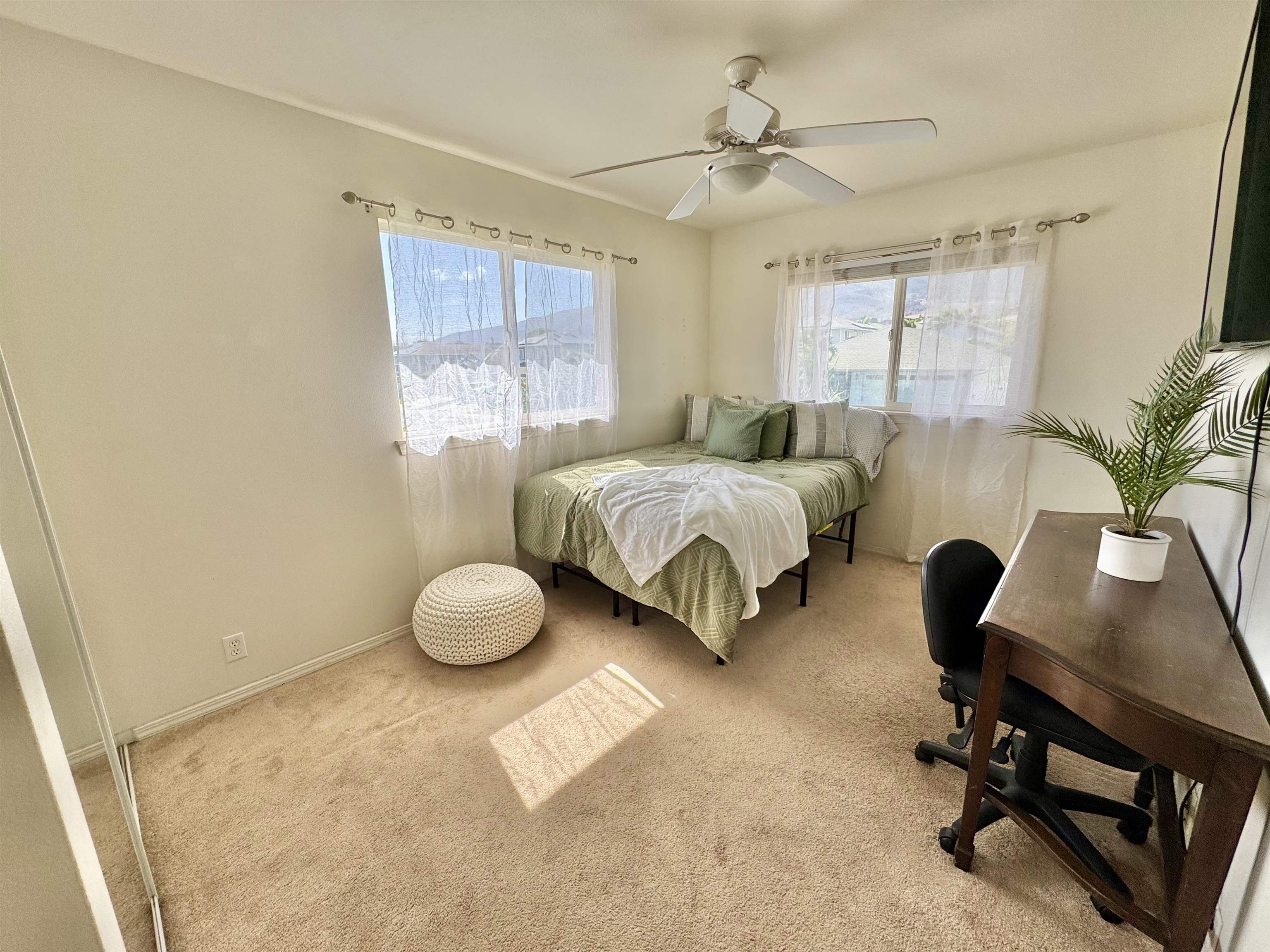159 Iniiniki Street Wailuku, HI 96793 - Photo 21 of 33 a bedroom with a bed and a chair