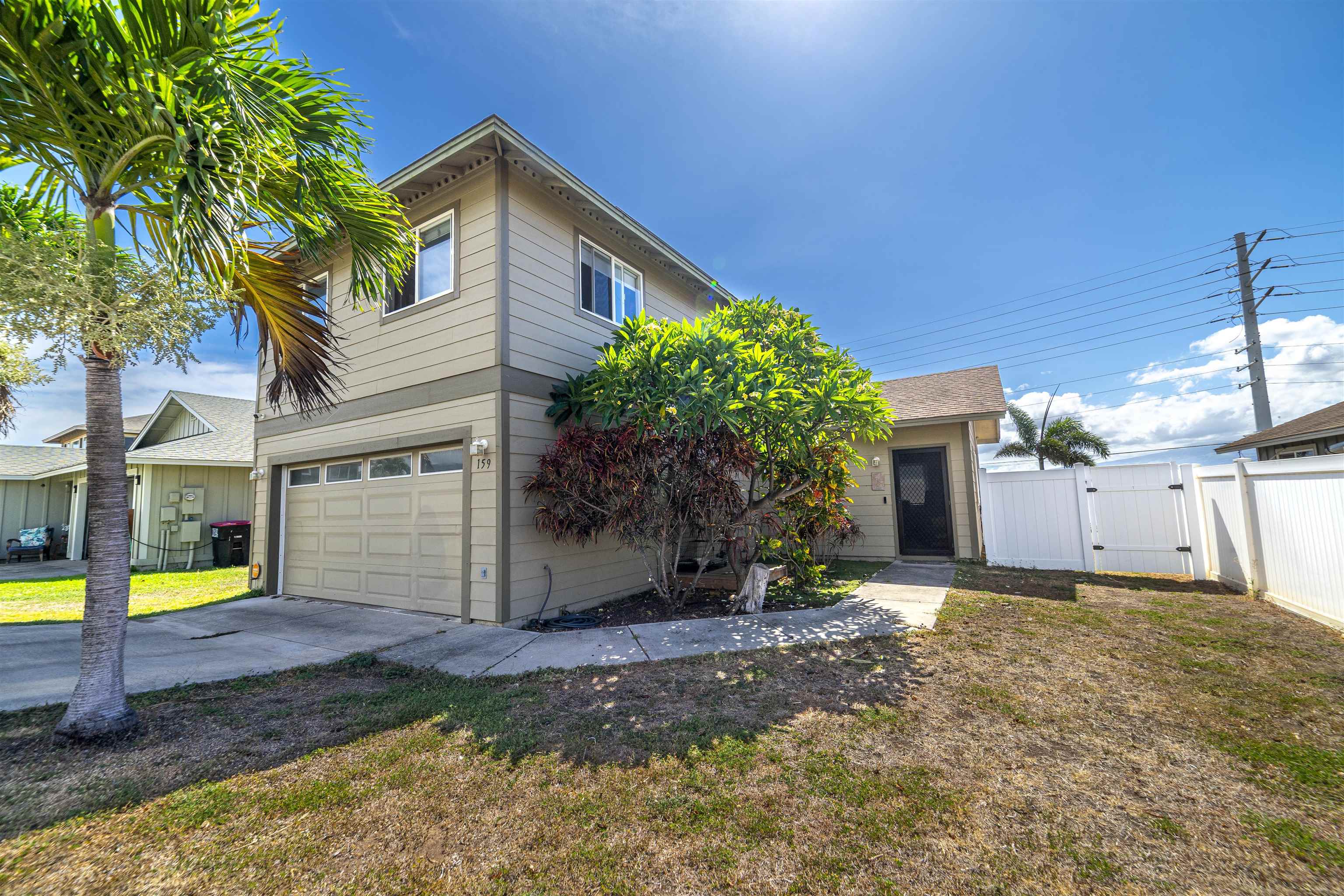159 Iniiniki Street Wailuku, HI 96793 - Photo 25 of 33 a view of a house with a yard and potted plants