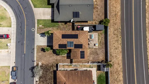 a view of living room with a fireplace and potted plants