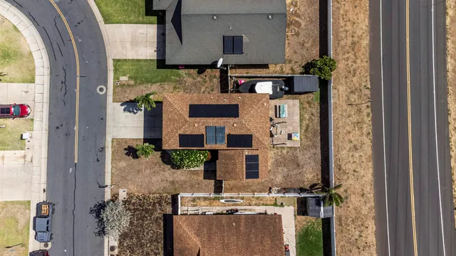 a view of living room with a fireplace and potted plants