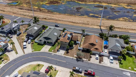 an aerial view of a house with a swimming pool