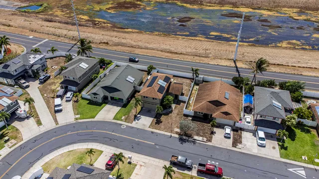 an aerial view of a house with a swimming pool