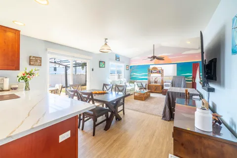 a living room with fireplace furniture and a flat screen tv