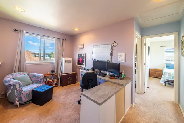 a bedroom with furniture and a window