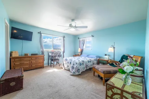 a bedroom with furniture and a bed